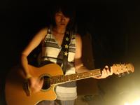 Fion leading worship by the campfire