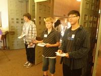 Kevin, John, and Tim greeting people